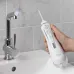 Ирригатор Waterpik WP-560ЕU портатив. импульсн. 4насад. белый